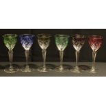 A set of six harlequin hock glasses, engraved and flashed bucket shaped bowls, faceted tapering