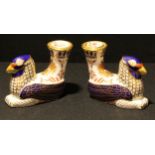 A pair of Royal Crown Derby Mythical Creatures candle holders, Griffins, first quality