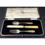 A George V christening set, comprising bone-handled knife and a silver spoon and fork, Cooper