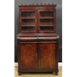 A Victorian mahogany library chiffonier, coronated cornice above a pair of glazed doors enclosing