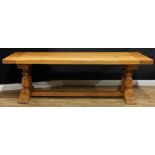 A large oak refectory trestle dining table, Monastere Chambord, rectangular top, turned pillars,