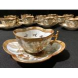 A Japanese egg shell coffee service, for twelve, comprising quartrefoil shaped cups and saucers,