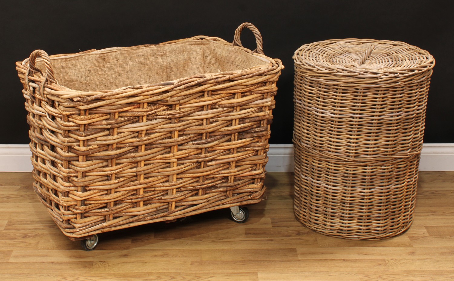 A large wicker log or laundry basket, 71.5cm high overall, 85cm high, 58cm deep, the basket 51cm