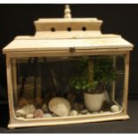 A wooden terrarium, containing a collection of shells. etc, 63cm long