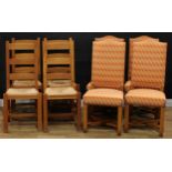 A set of four contemporary oak dining chairs, drop-in rush seats, 107cm high, 47cm wide, the seat