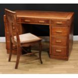 An Art Deco oak veneer twin pedestal desk, rectangular top with inset writing surface above three