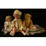 Toys - a 20th century golden plush type mohair jointed teddy bear, cm high; a porcelain head doll