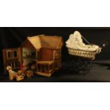 A scratch built wooden doll's house, fitted with handmade furniture and dolls; a miniature model