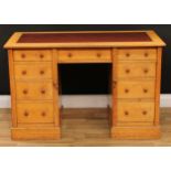 An Arts & Crafts period oak desk, rectangular top with moulded edge and inset writing surface