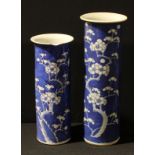 A Chinese cylindrical blue and white painted Prunus pattern vase, 30cm, cylindrical marks; another