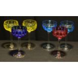 A set of six Walsh harlequin shallow wine glasses, engraved and flashed bowls in red, yellow and