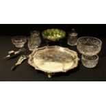 An EPNS shaped circular tray; an EP lobed circular fruit/bon-bon dish with shaped green glass liner;