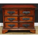 A contemporary acacia chest, oversailing rectangular top above six short drawers, skirted base,