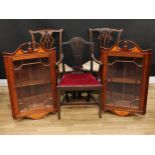 A pair of Sheraton Revival style mahogany wall hanging splay front corner display cabinets, 93cm