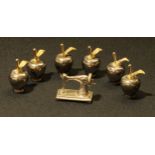 A set of six miniature novelty apple shaped name place holders, 4cm; a miniature silver sewing