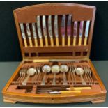 A walnut quarter veneered canteen of flatware, Derby & Sons Sheffield, fitted, 48cm wide