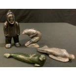 Levi Amidlak (1931-1998) Canadian, an Inuit stone carving as a Hunter, signed, numbered E-91564,