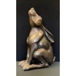 A bronze coloured figure, Mooning Hare staring aloft, 41cm high.