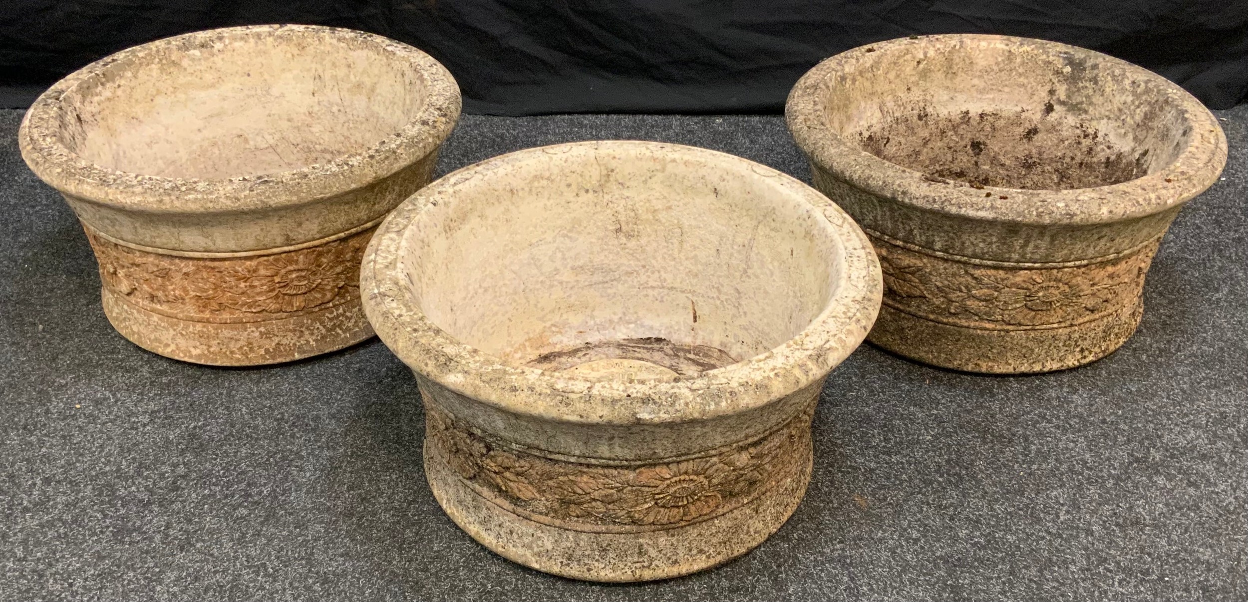 A set of three large, 'Willowstone' re-constituted stone, garden planters, each measuring 51cm