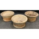 A set of three large, 'Willowstone' re-constituted stone, garden planters, each measuring 51cm