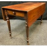 A Victorian mahogany Pembroke table, rectangular top, single frieze drawer, turned cylindrical legs,