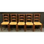 A set of 19th century oak chapel chairs, rush seats.(5)