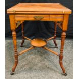 An Edwardian satin walnut envelope card table, tooled leather and baize surface, drawer to frieze,