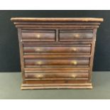 Miniature Furniture - a 19th century stained pine chest, of two short and three long drawers, 30cm