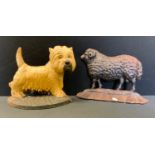 A Cast Iron West High Land Terrier Door Stop; another Ram.