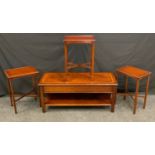 A reproduction mahogany coffee table, rectangular top with bead inlay, 46cm high, 106cm wide, 45cm