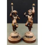 A pair of Bronze Cherub table lamps, cast stepped bases, design lozenge, 27cm high