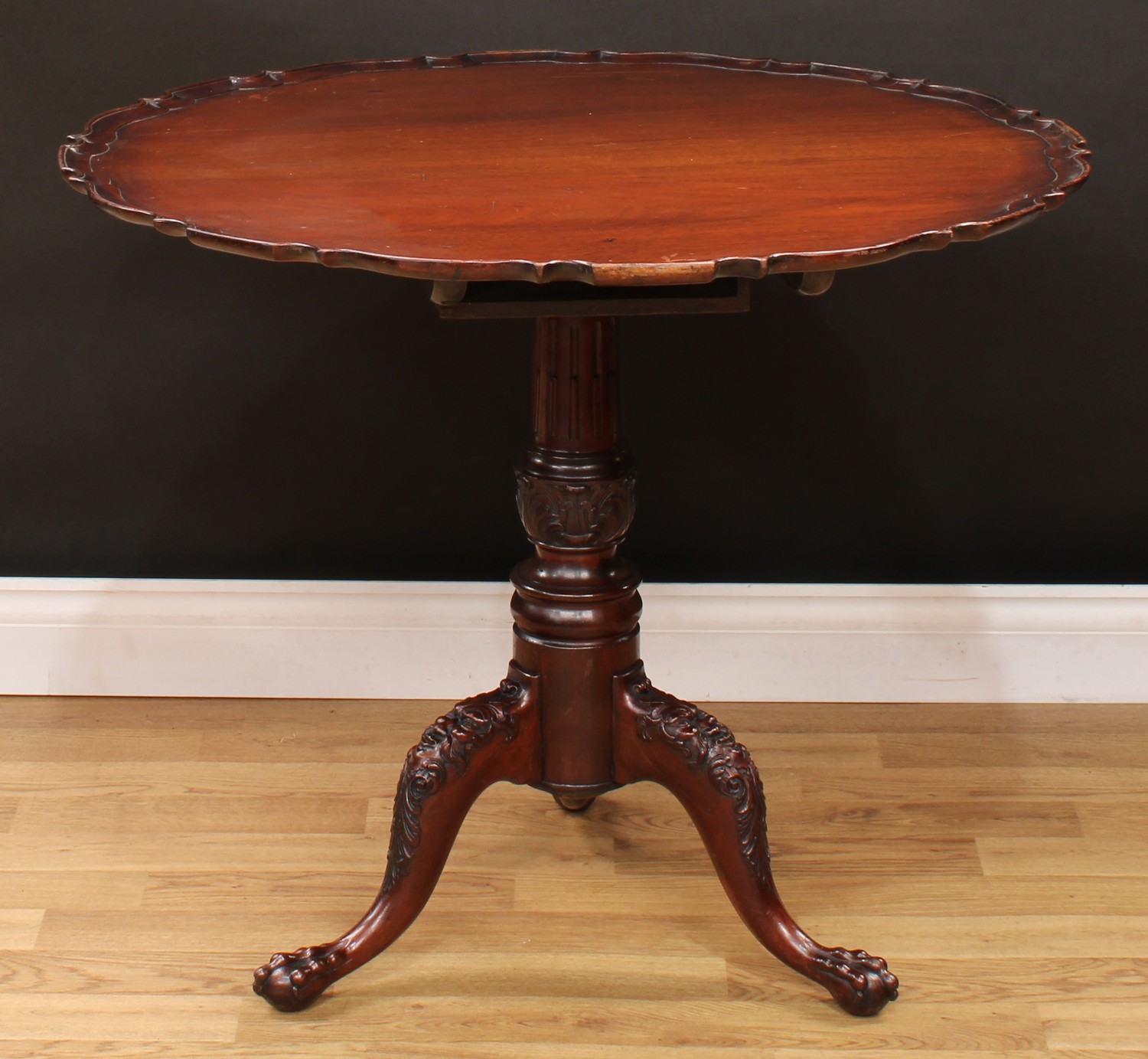 A 19th century mahogany tripod occasional table, shaped circular top with pie-crust edge, stop-