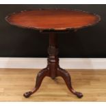 A 19th century mahogany tripod occasional table, shaped circular top with pie-crust edge, stop-