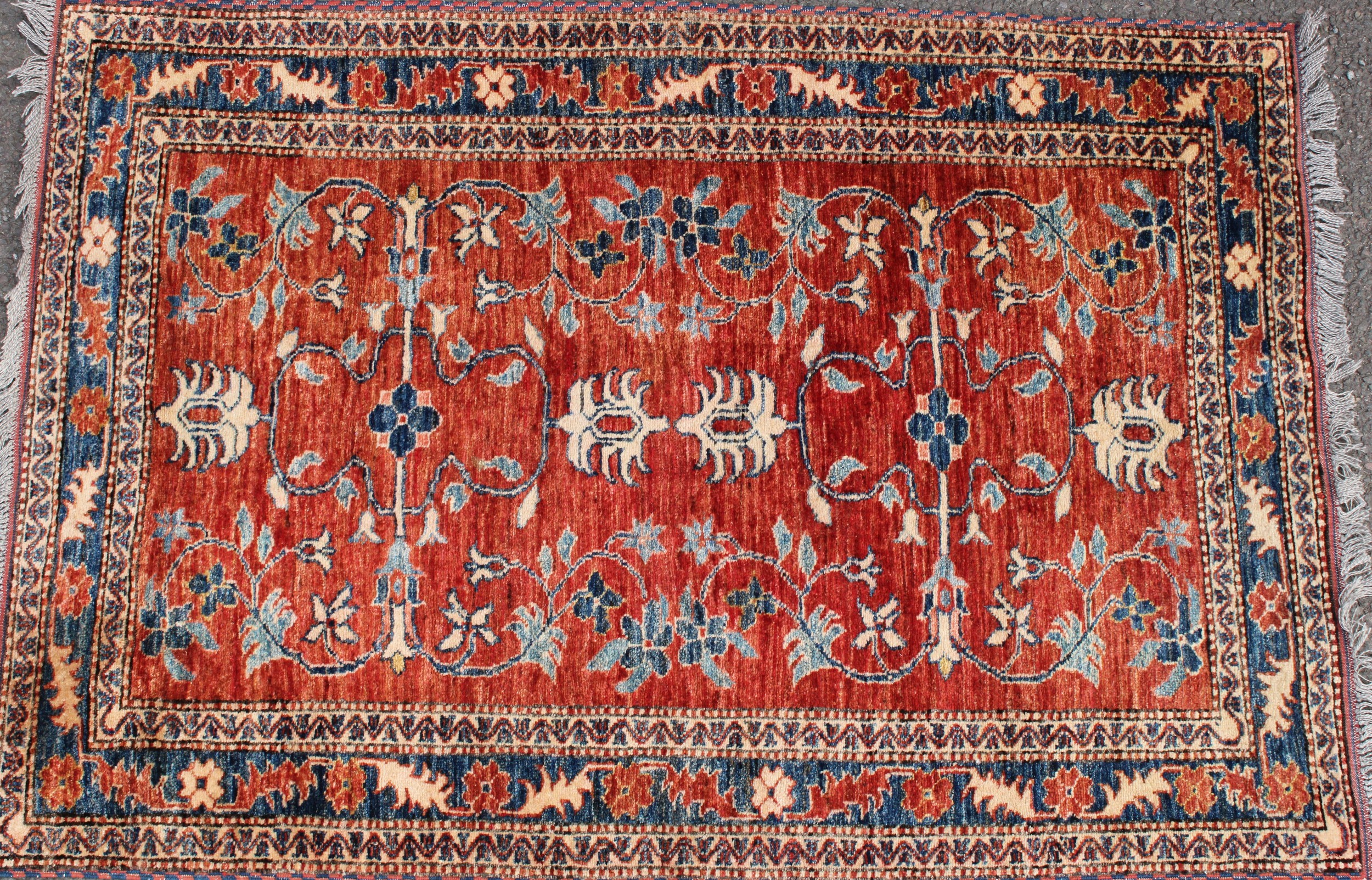 A Middle Eastern rug, worked in the traditional manner, 152cm x 102cm