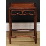 A Chinese hardwood rectangular occasional table, panel top above a shaped frieze pierced and