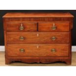 A George III mahogany chest, slightly oversailing rectangular top above two short and two long