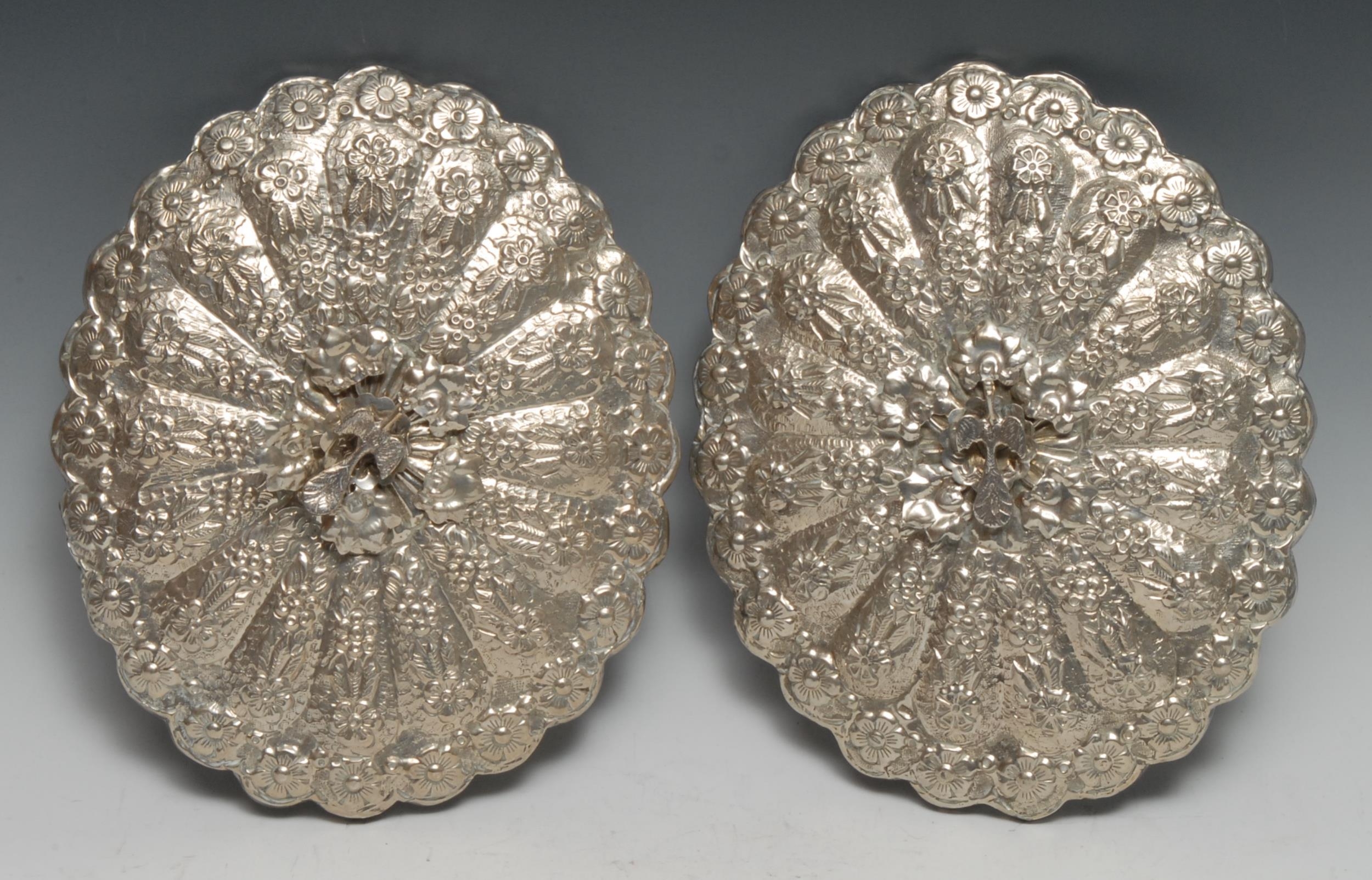 A pair of Turkish silver shaped oval mirrors, chased with flowers and applied with peacocks, 22cm - Image 3 of 4