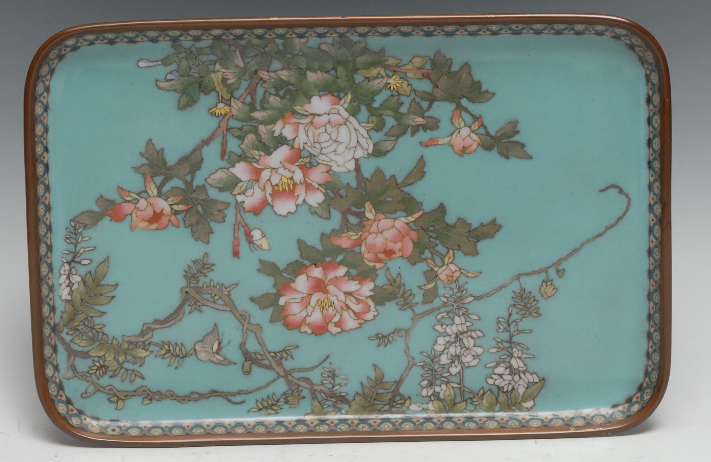 A Japanese Cloisonné rounded rectangular tray decorated with butterfly's amongst flowering prunus