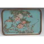 A Japanese Cloisonné rounded rectangular tray decorated with butterfly's amongst flowering prunus