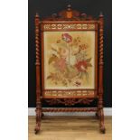 A substantial Victorian oak firescreen, shaped and pierced cresting carved with scrolls, above a