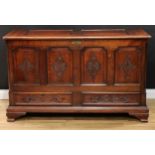 An 18th century oak mule chest, hinged two panel top enclosing a till and two small drawers, the