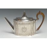 A George III Irish silver commode shaped teapot, hinged lofty fluted cover with pineapple finial,