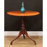 A George III mahogany tripod occasional table, circular tilting top, turned pillar, downswept