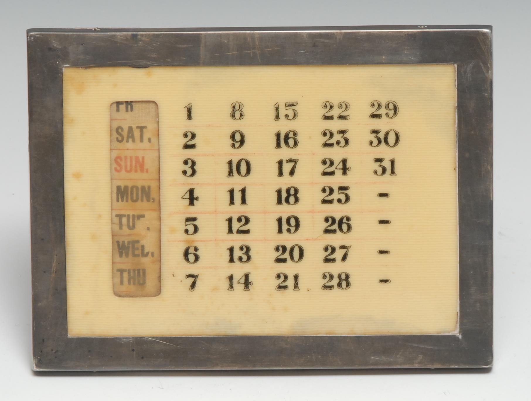A George V silver rectangular easel desk calendar, 15cm wide, Birmingham 1921