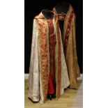Ecclesiastical Liturgical Vestments - a cope, richly embroidered in gilt threads on red stain and