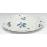A Worcester shaped oval basket wave moulded dish, in relief with leaves, printed with flowers,