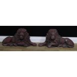 A pair of Regency design reconstituted ornamental lions, flatbacks, 68cm long