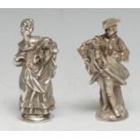 A good pair of German Rococo Revival silver figural scent bottles, cast and chased as a man