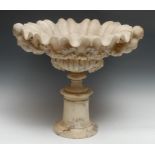 A 19th century alabaster sculptural table-centre, half-fluted scallop shell plateau carved with a