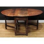 A 17th century oak gateleg table, oval top with fall leaves above a frieze drawer, turned and